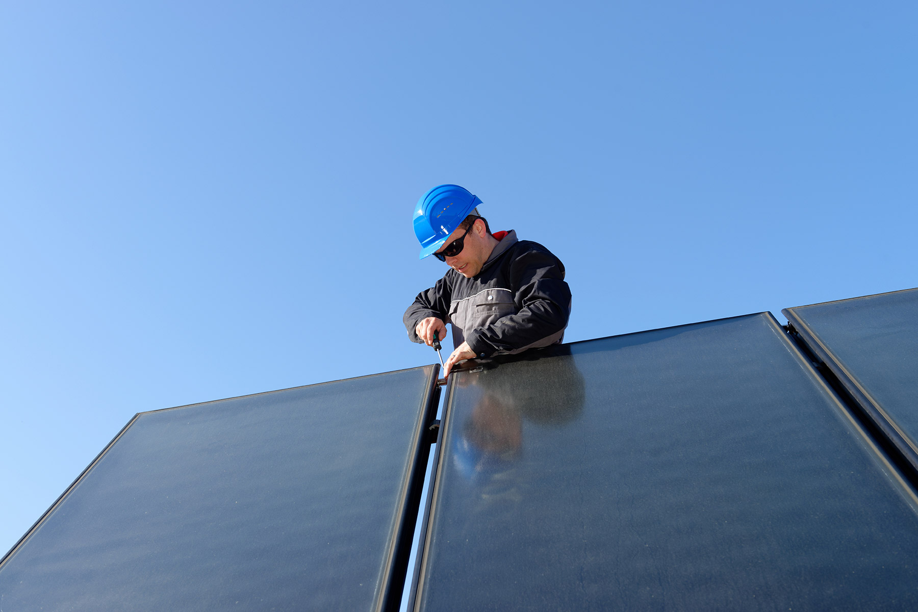 solar panel worker installing residential solar panel millersburg pa